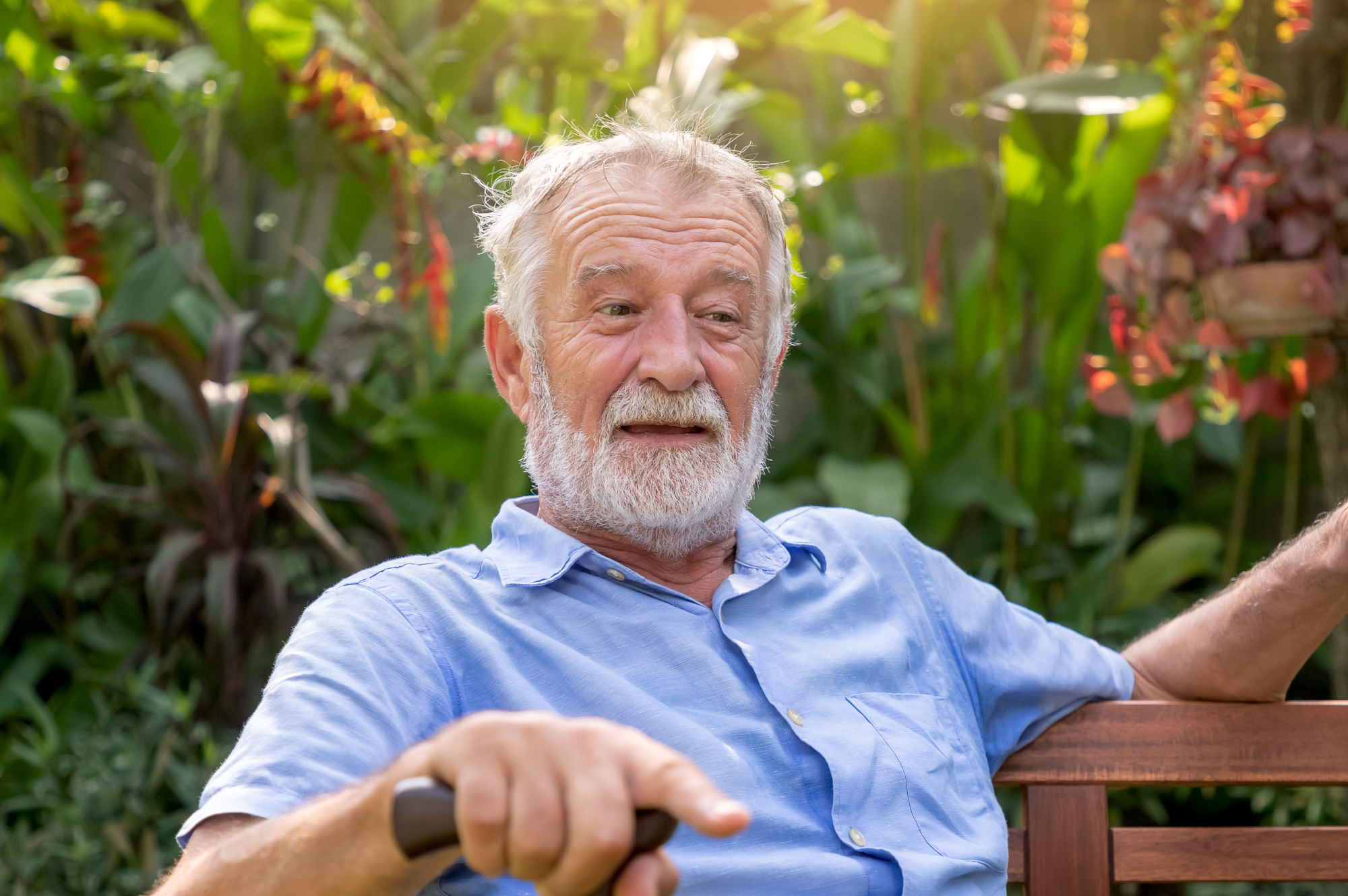 happy-senior-sitting-bench-Freepik